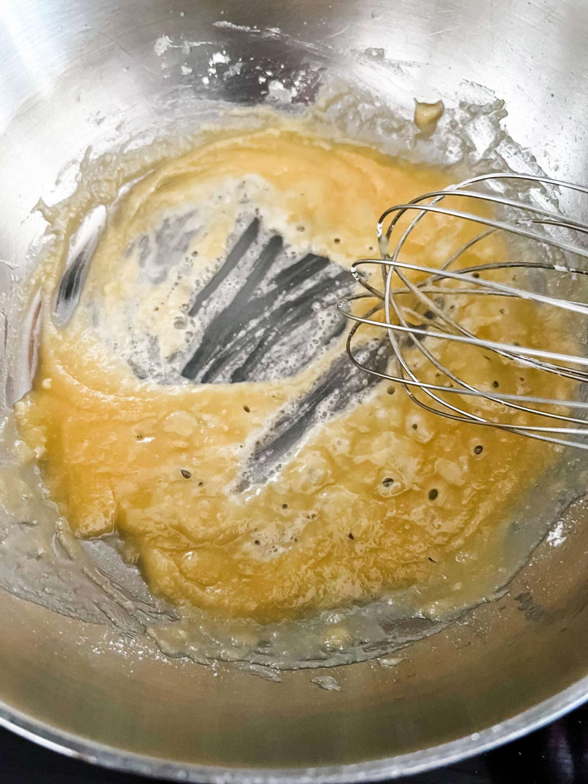 A roux that has just been started in a large pot.