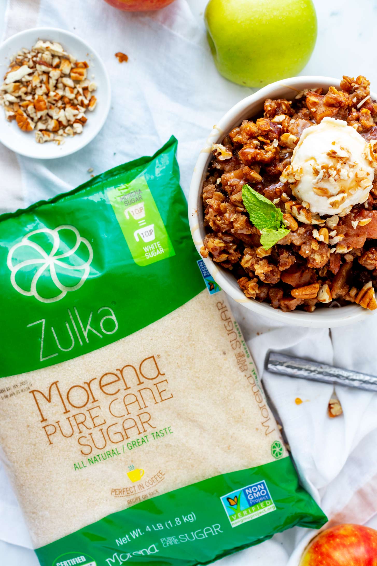 Overhead photo of Zulka Morena pure cane sugar sitting next to a slow cooker apple crisp.