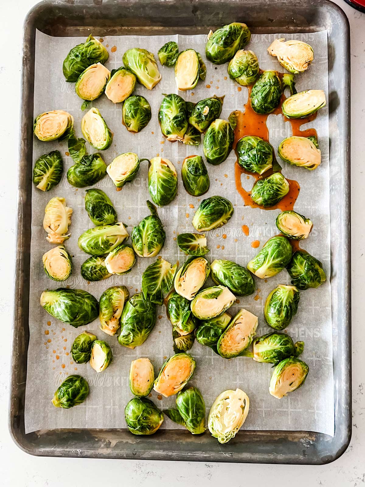 Overhead photo of honey sriracha brussels sprouts ready for the oven.