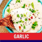 Close up photo of garlic parmesan sauce in a small blue dish.