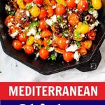 A photo of a skillet with tomato topped Mediterranean Chicken with the text below that says Mediterranean Chicken Breast Recipe.