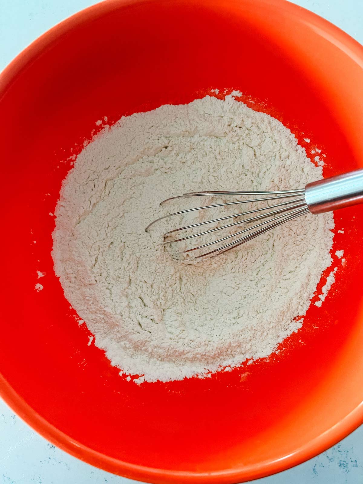 Flour, salt, sugar, and baking soda whisked together in a large bowl.