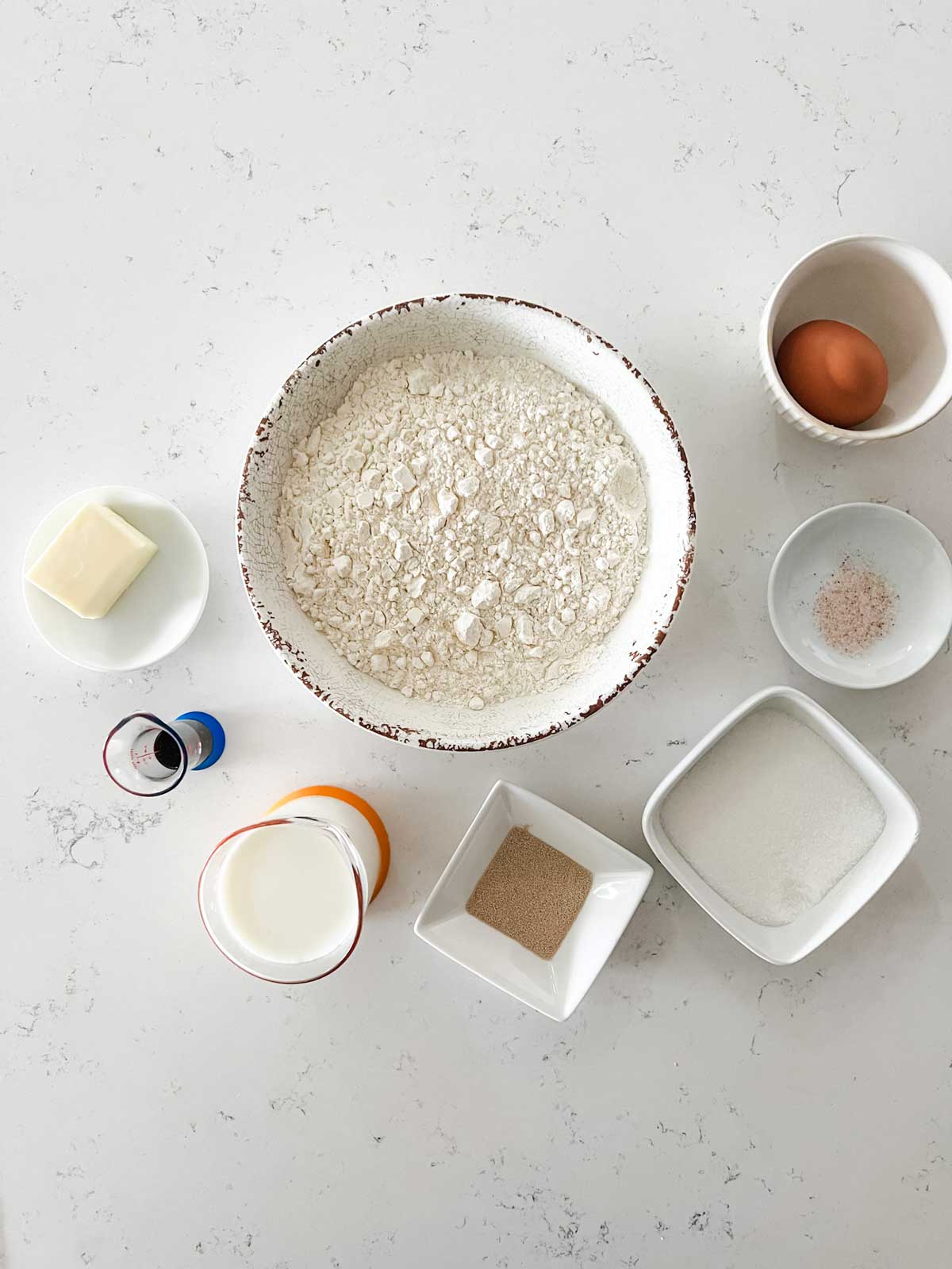 Overhead photo of ingredients for cinnamon roll dough.