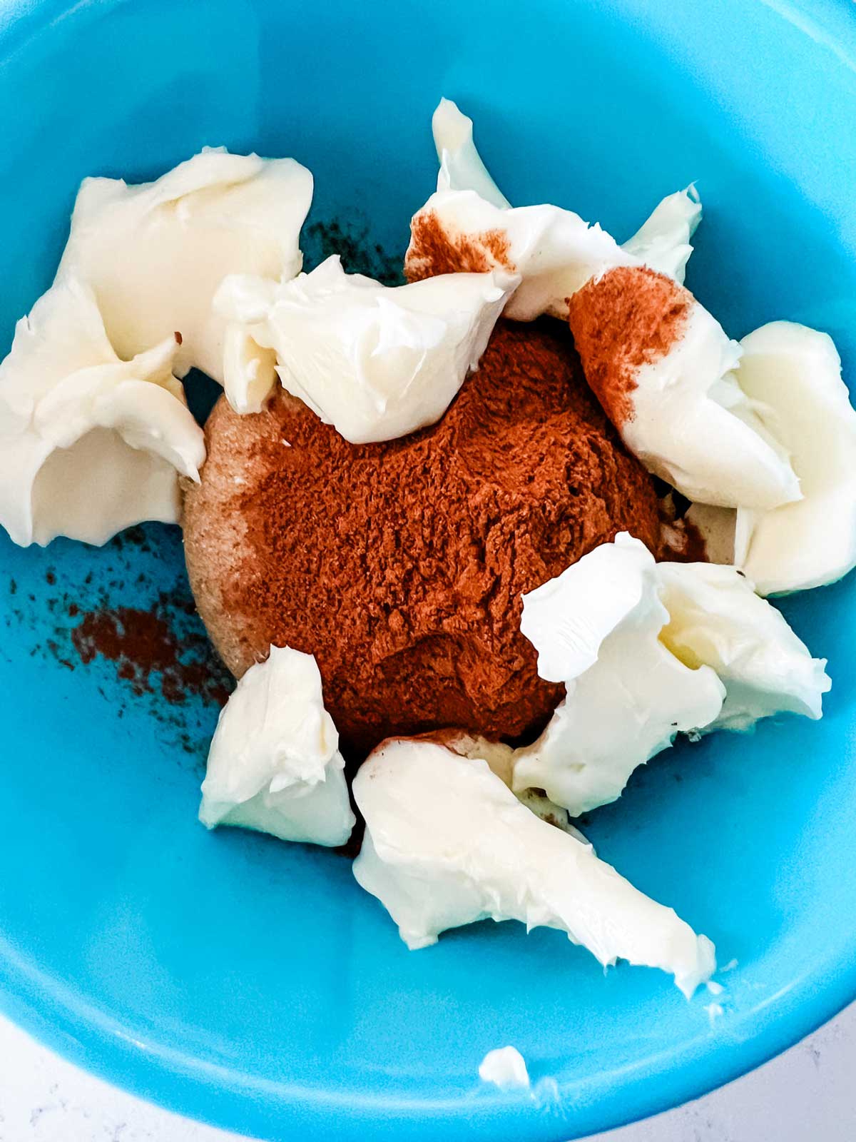Filling ingredients for cinnamon rolls in a blue bowl.