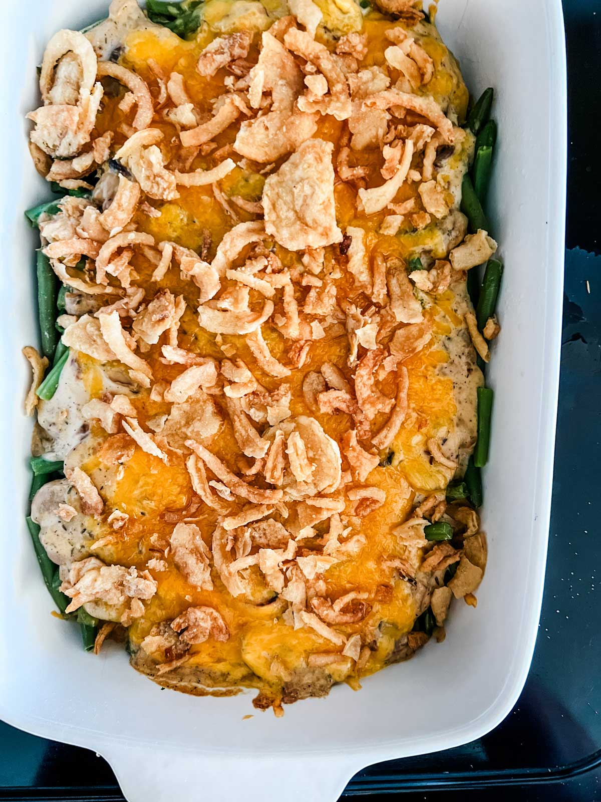 Green bean casserole with crispy fried onions on top.