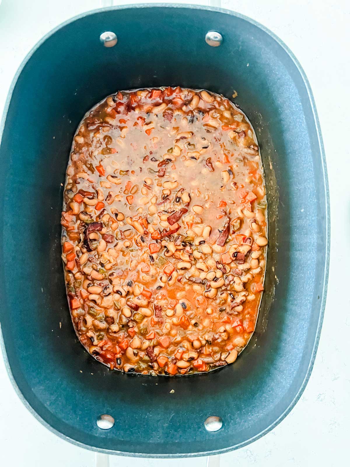 Black eyed peas in a slow cooker that they have been cooked in.