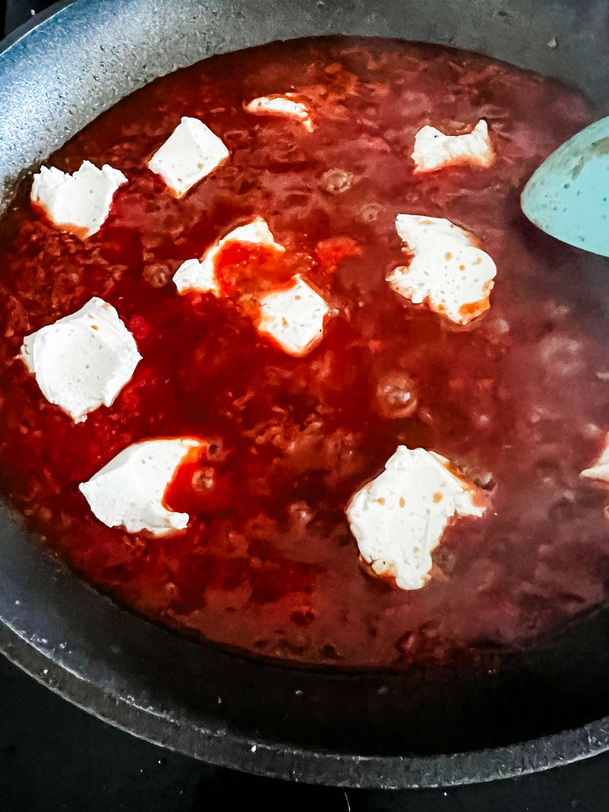  tomato sauce, broth, cream cheese in a skillet.