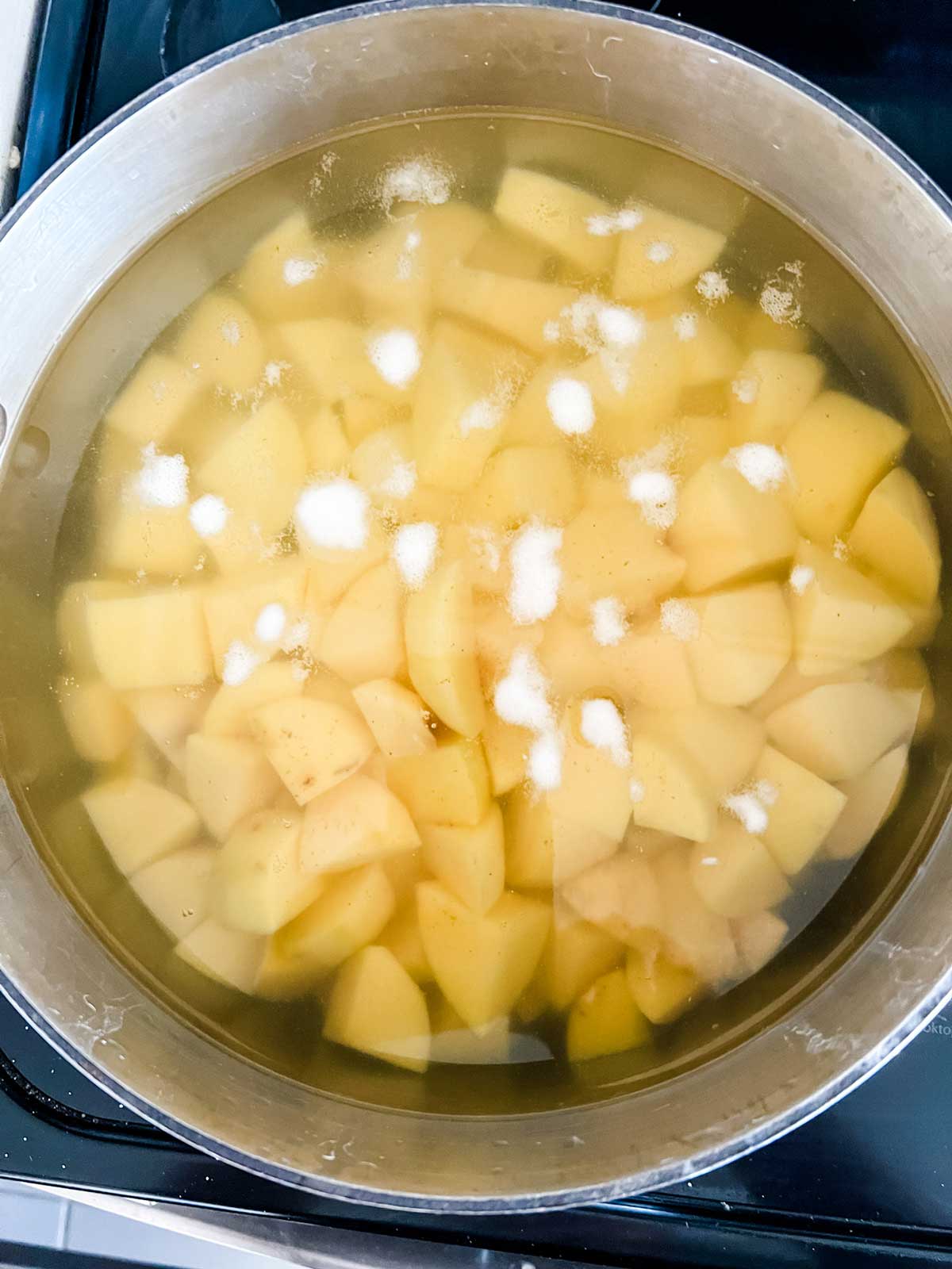 Diced yukon gold potatoes in a pot of water.