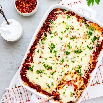 Overhead photo of a casserole dish with baked spaghetti with cream cheese.