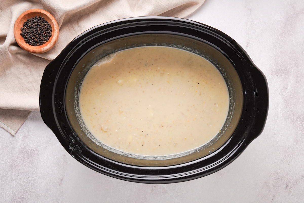 Creamy potato soup in a slow cooker.