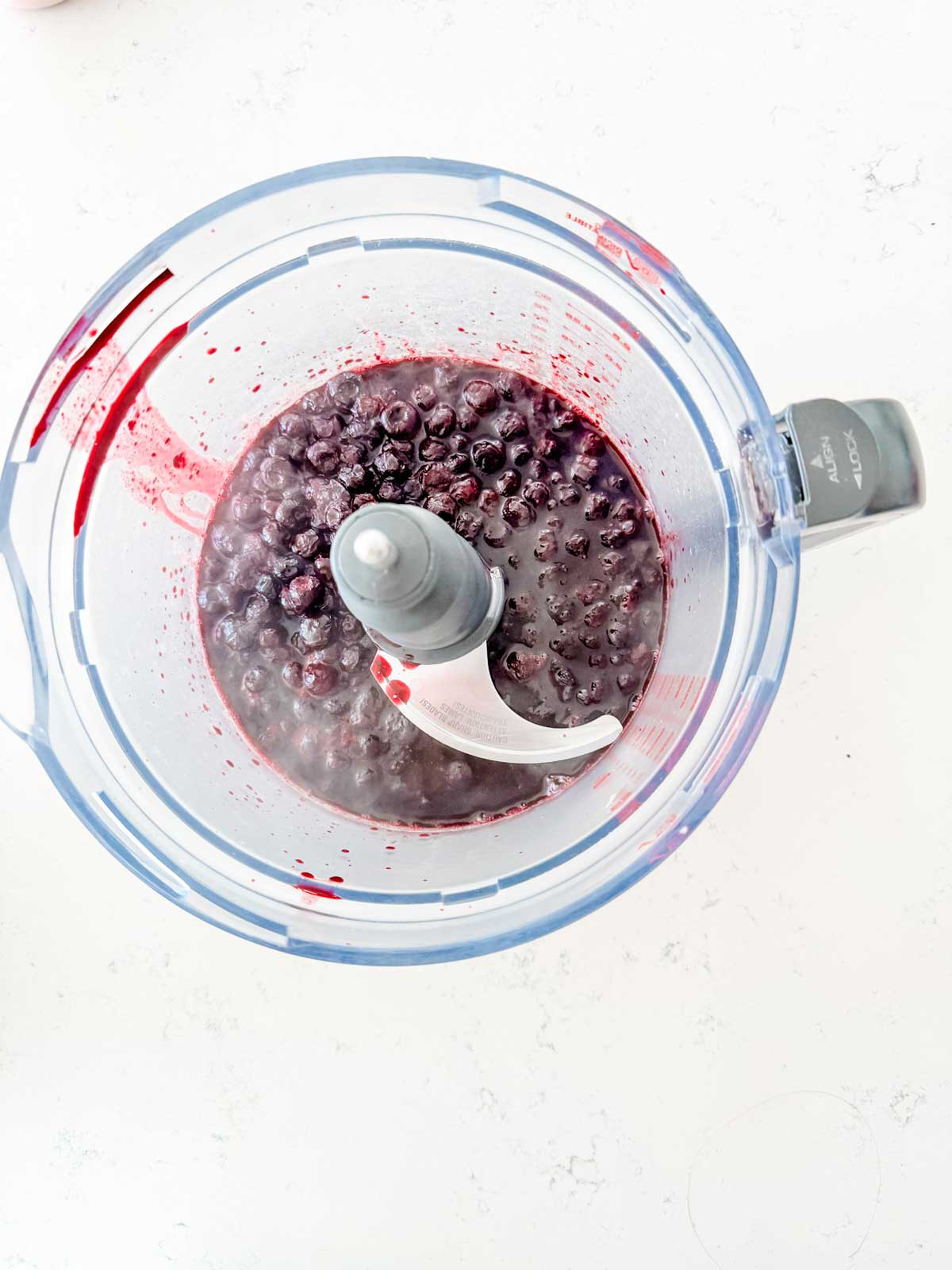 Blueberry compote in a food processor.