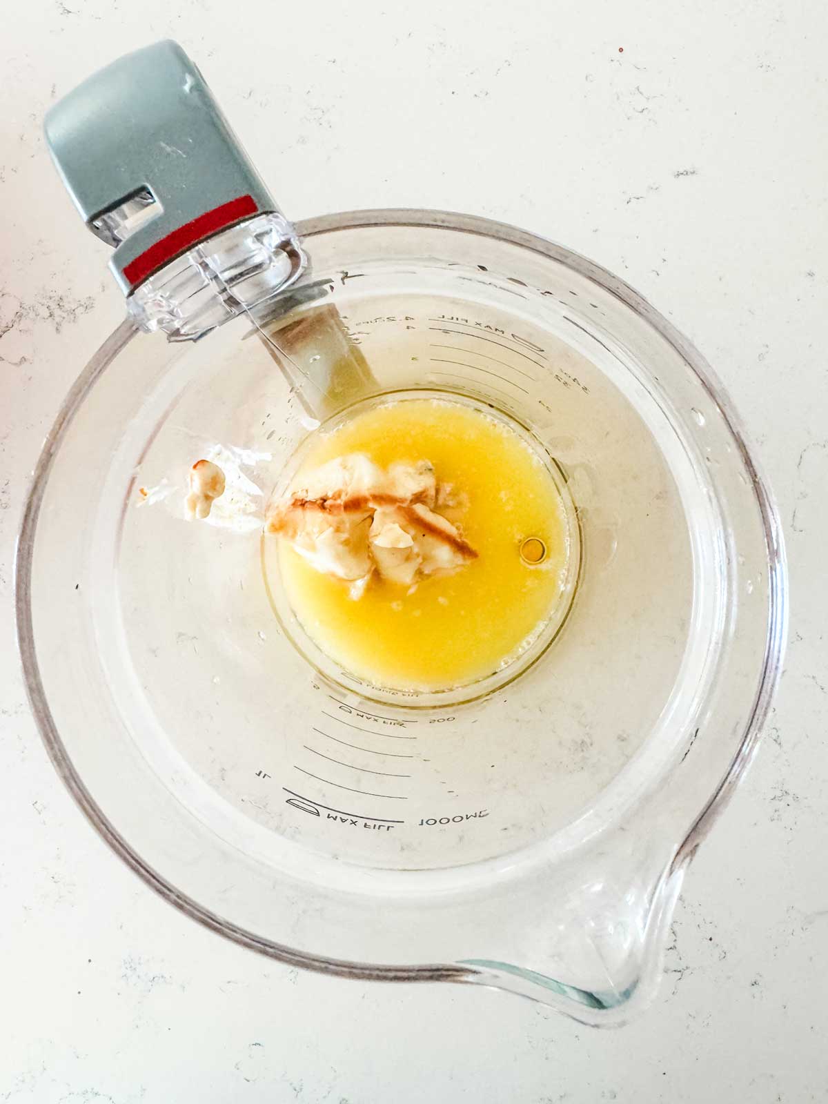 Melted butter, yogurt, eggs, honey, and vanilla in a blender. 
