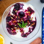 Square overhead photo of Ninja Creami protein ice cream topped with blueberry compote.