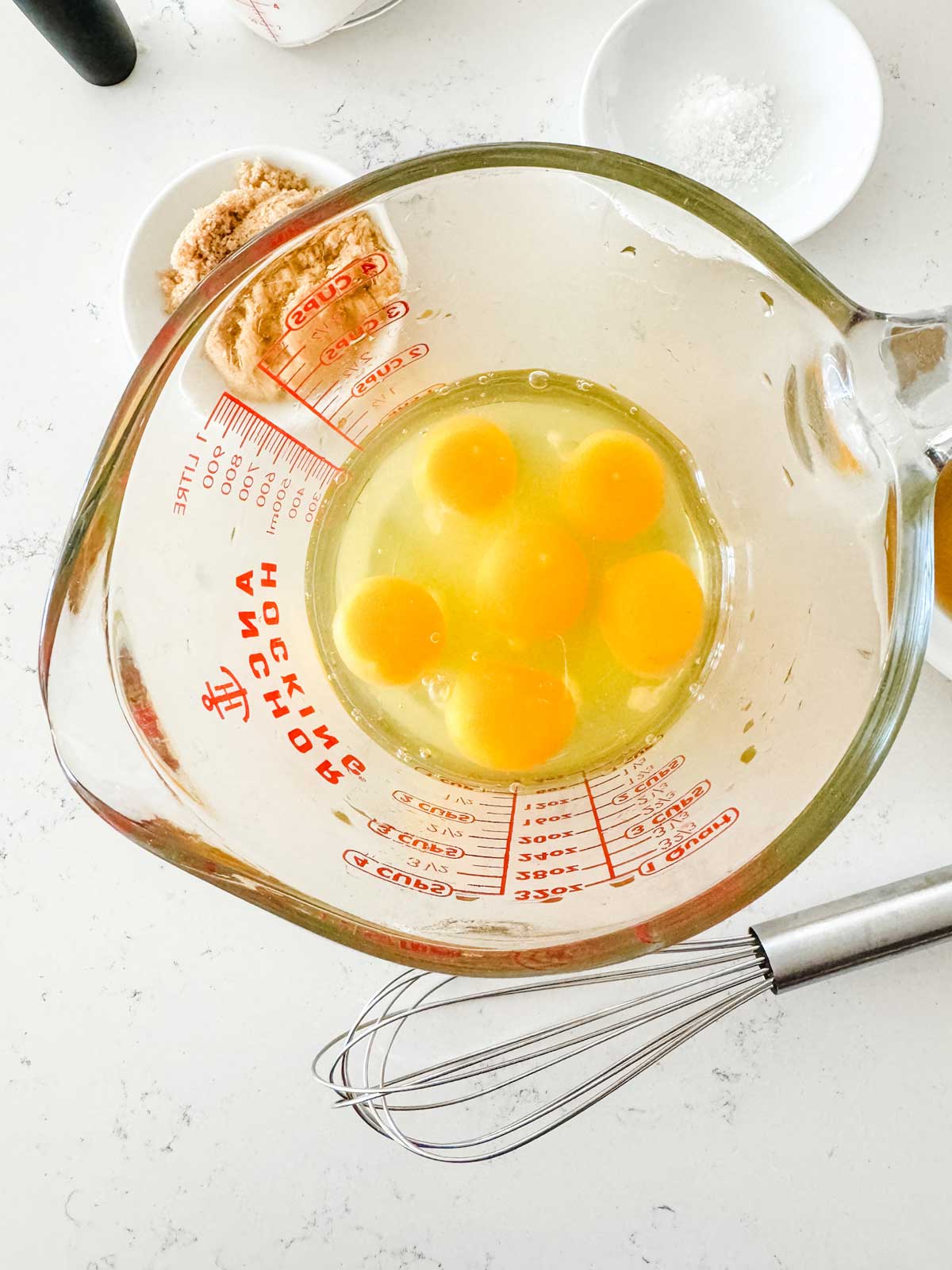 Eggs in a large measuring cup.