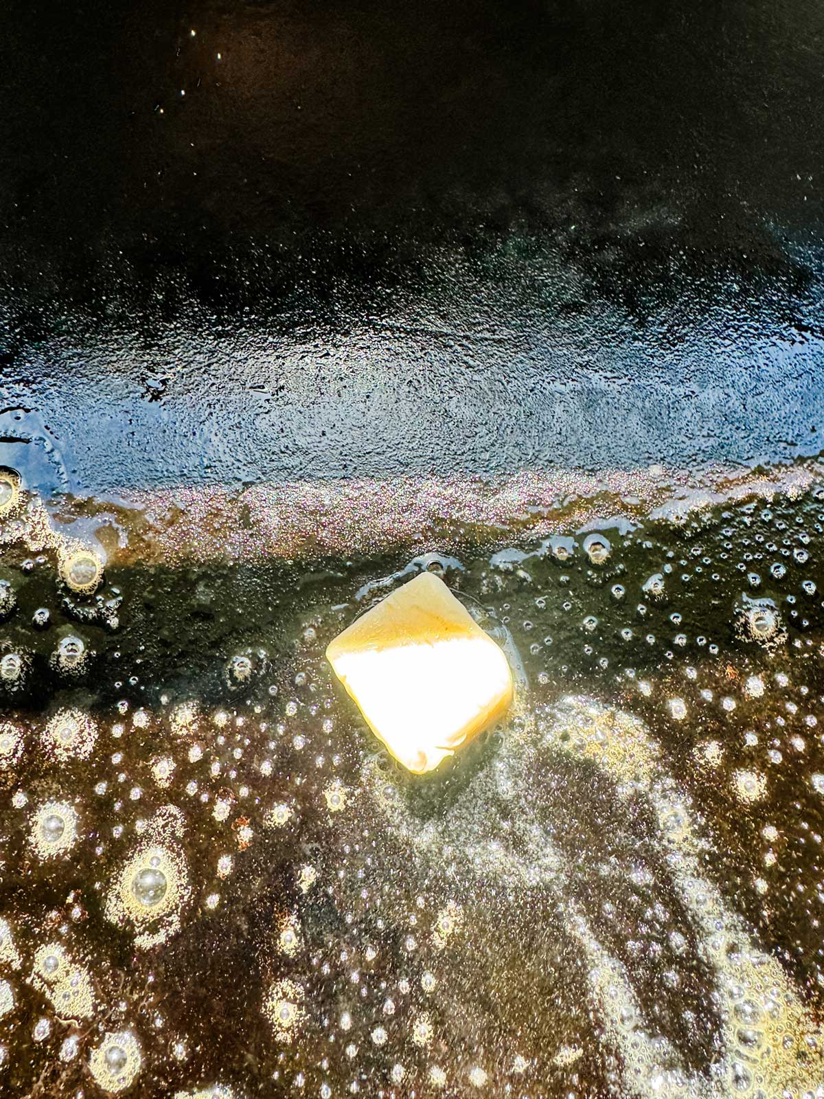 Butter melting on a Blackstone griddle.