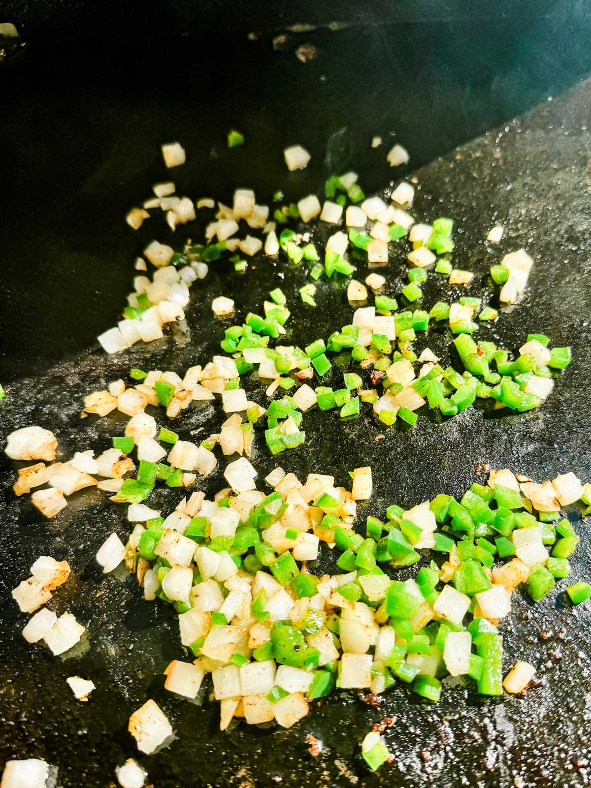 Jalapeno and onion cooking on the Blackstone griddle.