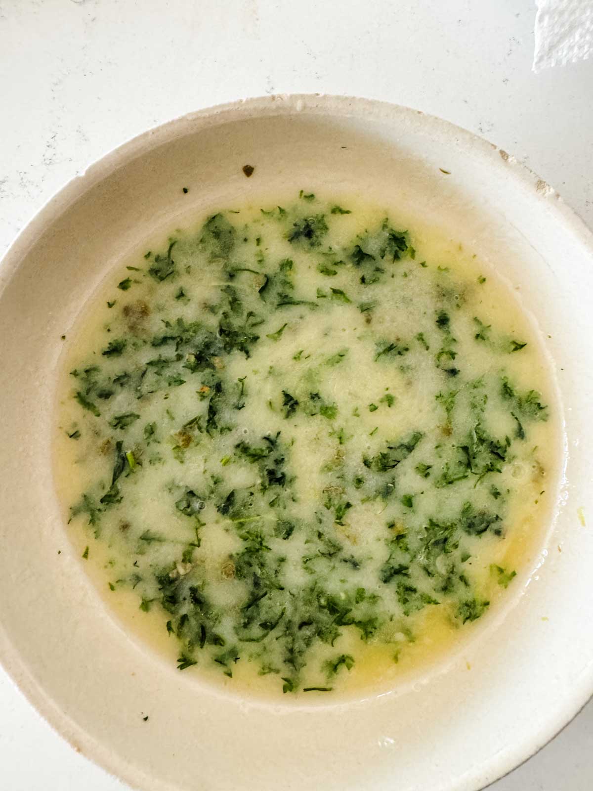 Parsley butter in a bowl.