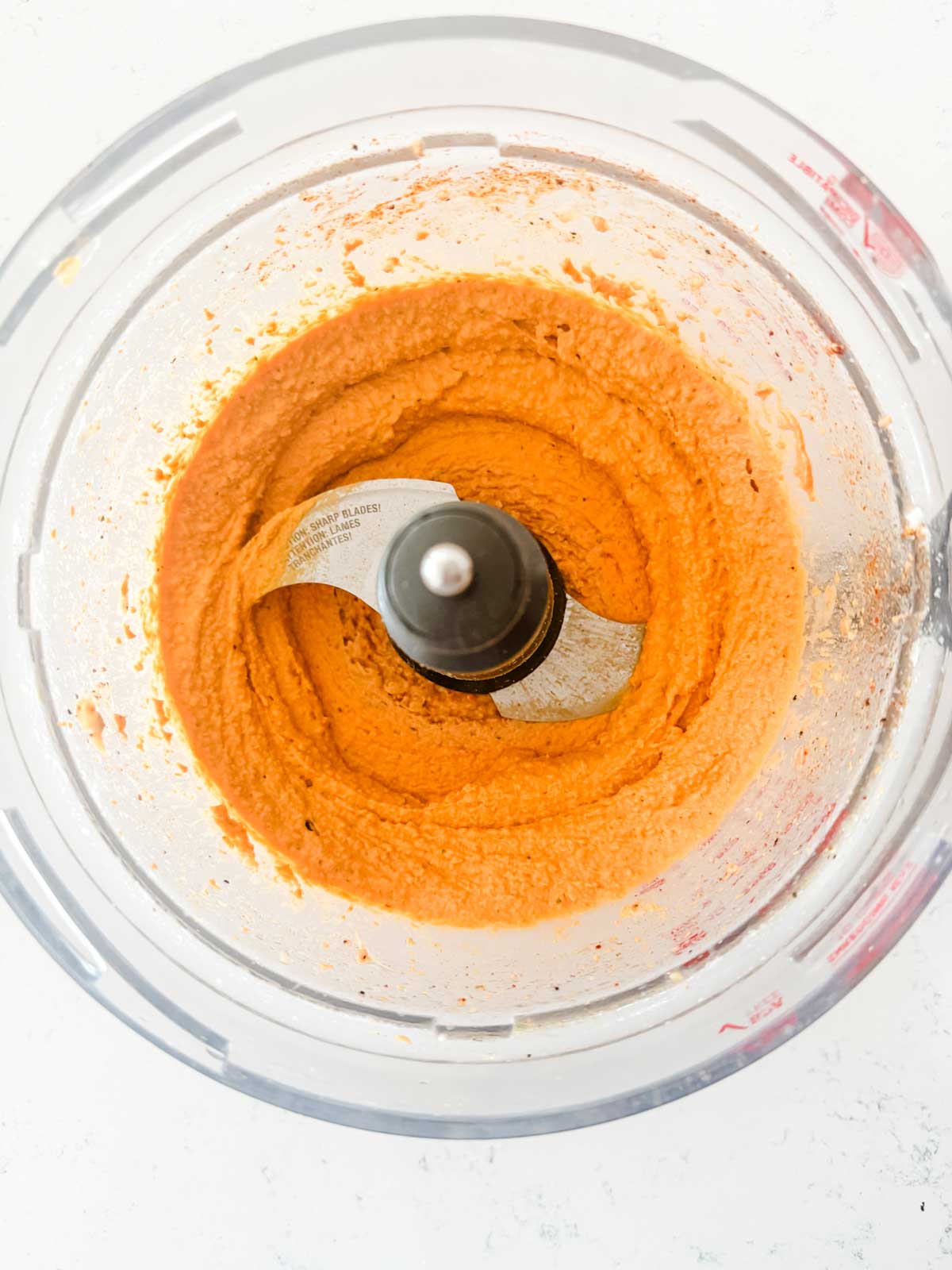 Hummus that has just been blended in a food processor.
