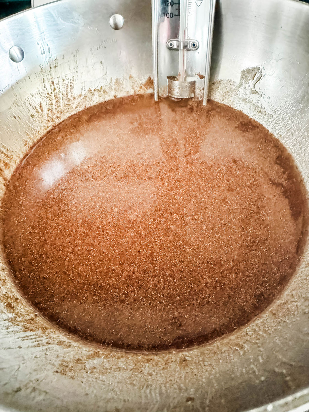 A spiced sugar mixture in a saucepan.