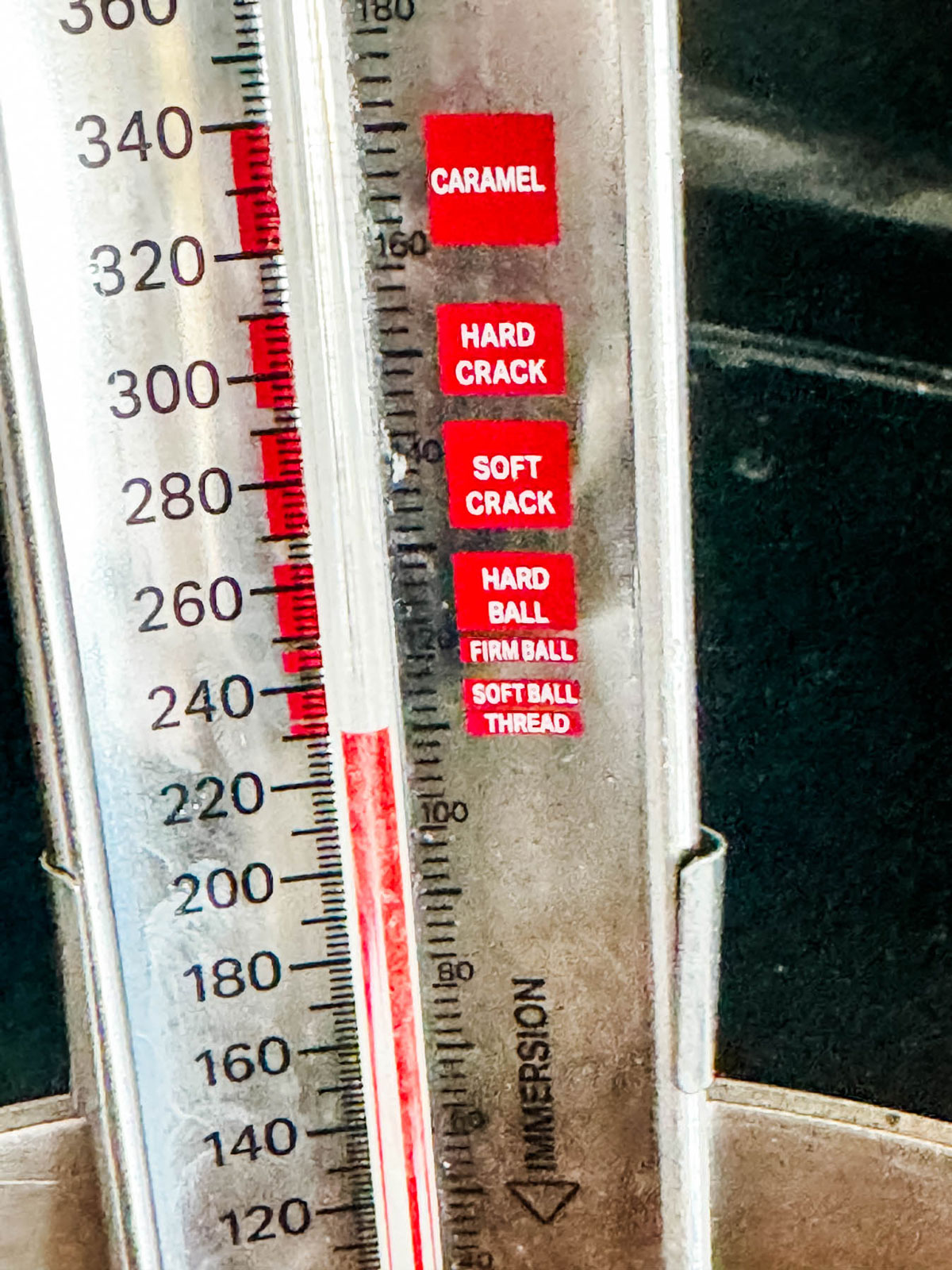 A candy thermometer at soft crack stage.