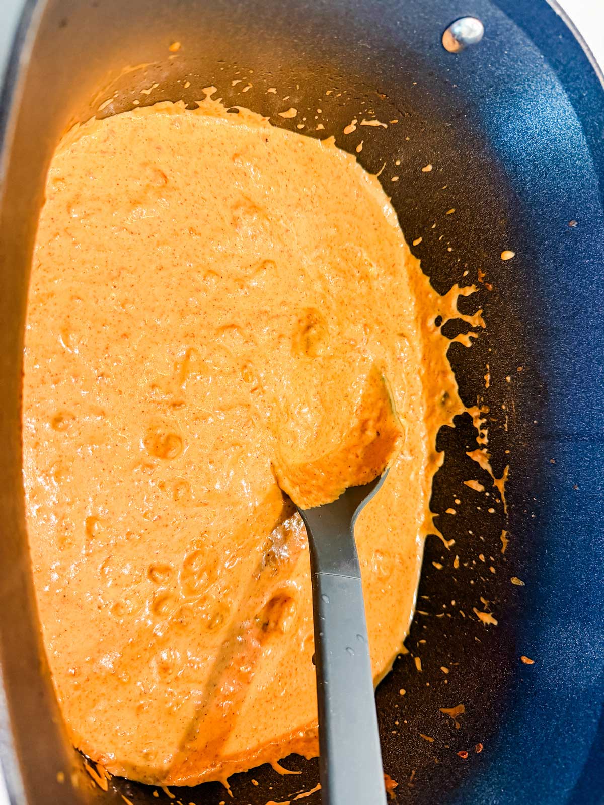 A Ninja Possible slow cooker with rotel cheese dip.
