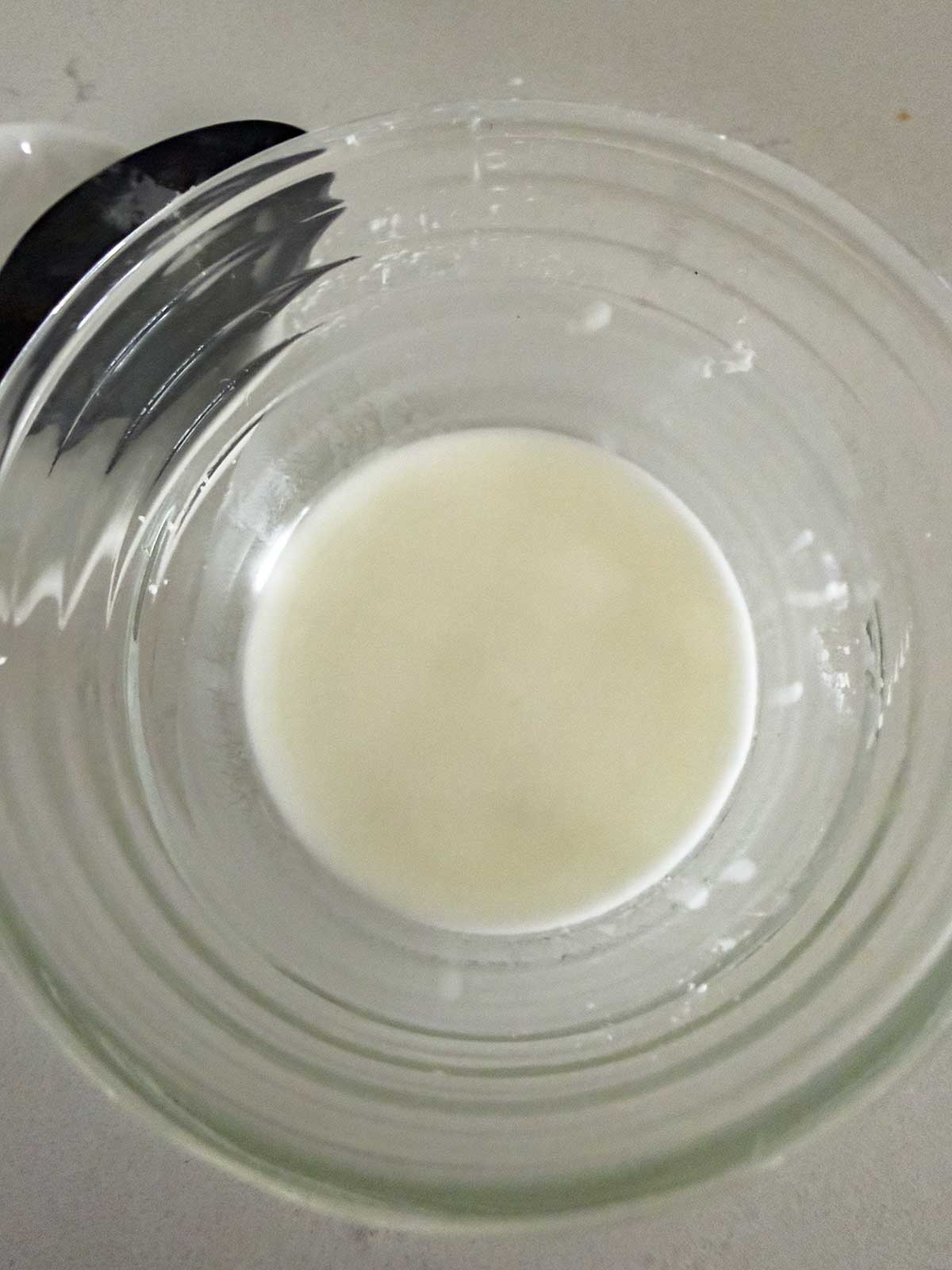 Cornstarch slurry to thicken teriyaki sauce in a small glass bowl.