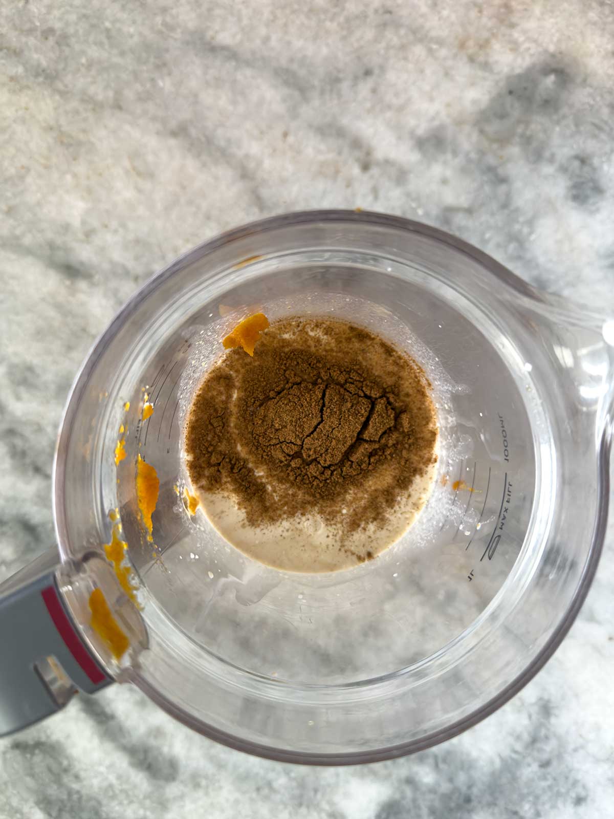 Pumpkin ice cream ingredients in a blender.